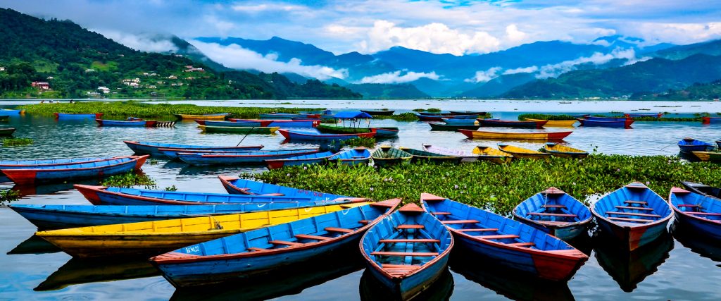 Colorful,Row,Boats,Docked,On,Lake,Phewa,In,Pokhara,,Nepal.